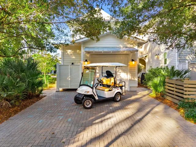 a view of a back yard of the house and a lots of trees