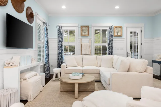 a living room with furniture and a flat screen tv