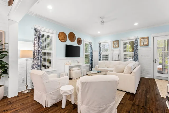 a living room with furniture and a flat screen tv