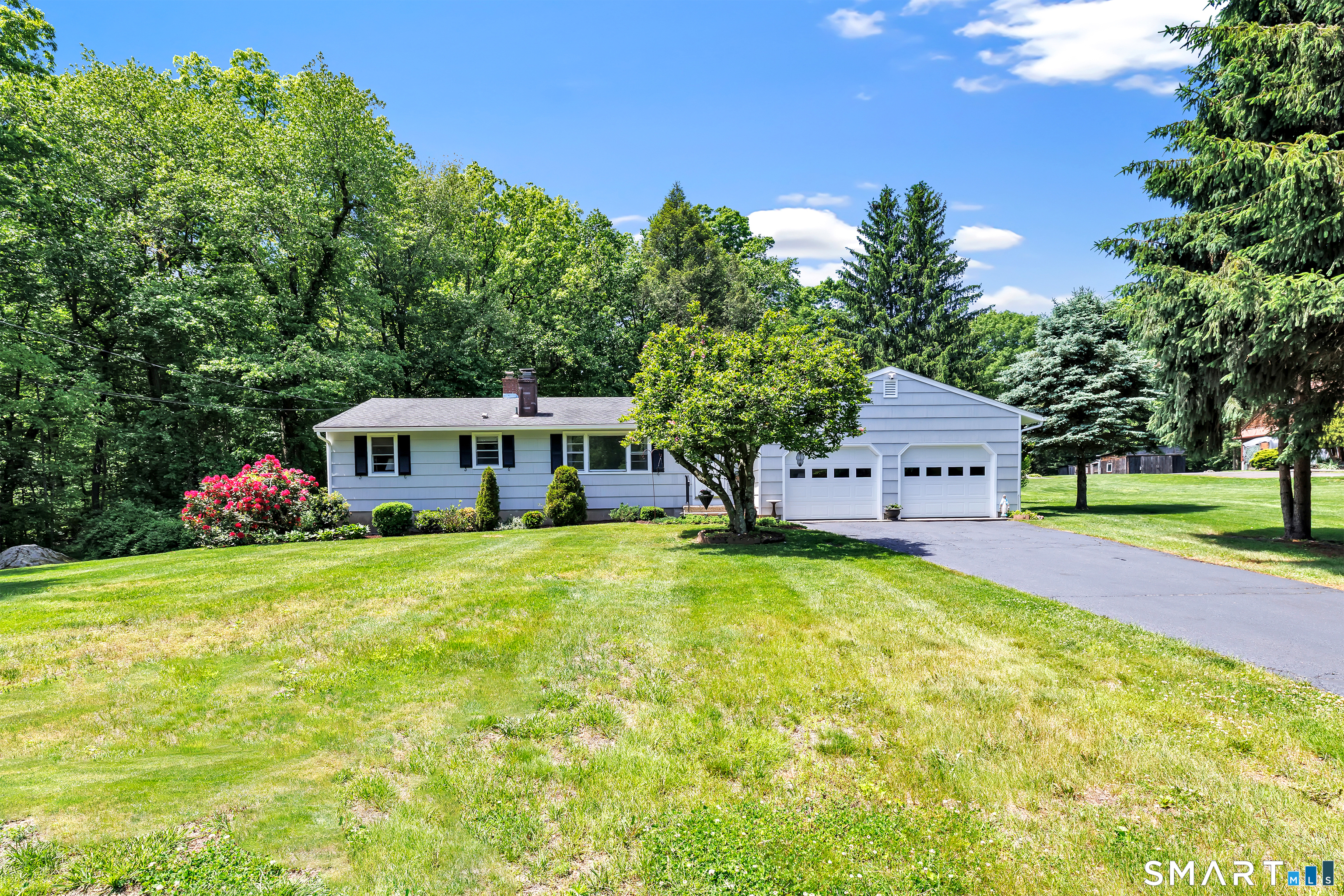 223 Wheeler Road Monroe, CT 06468 - Photo 1 of 35 a front view of a house with garden
