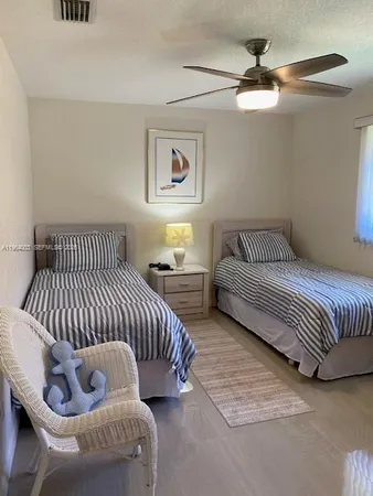 a bedroom with furniture and a window