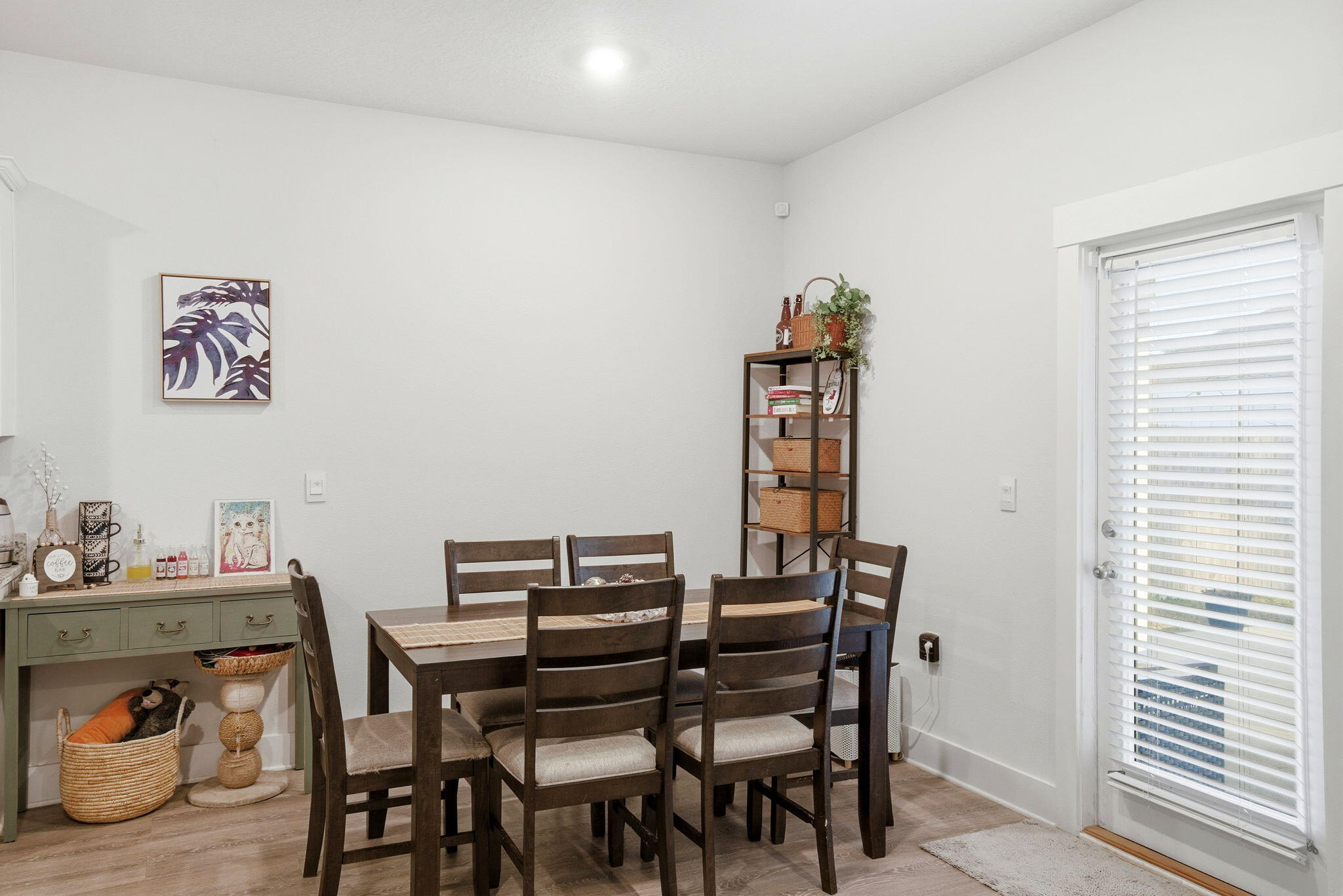 4067 Blaney Lane Pace, FL 32571 - Photo 11 of 40 a view of a dining room with furniture and wooden floor