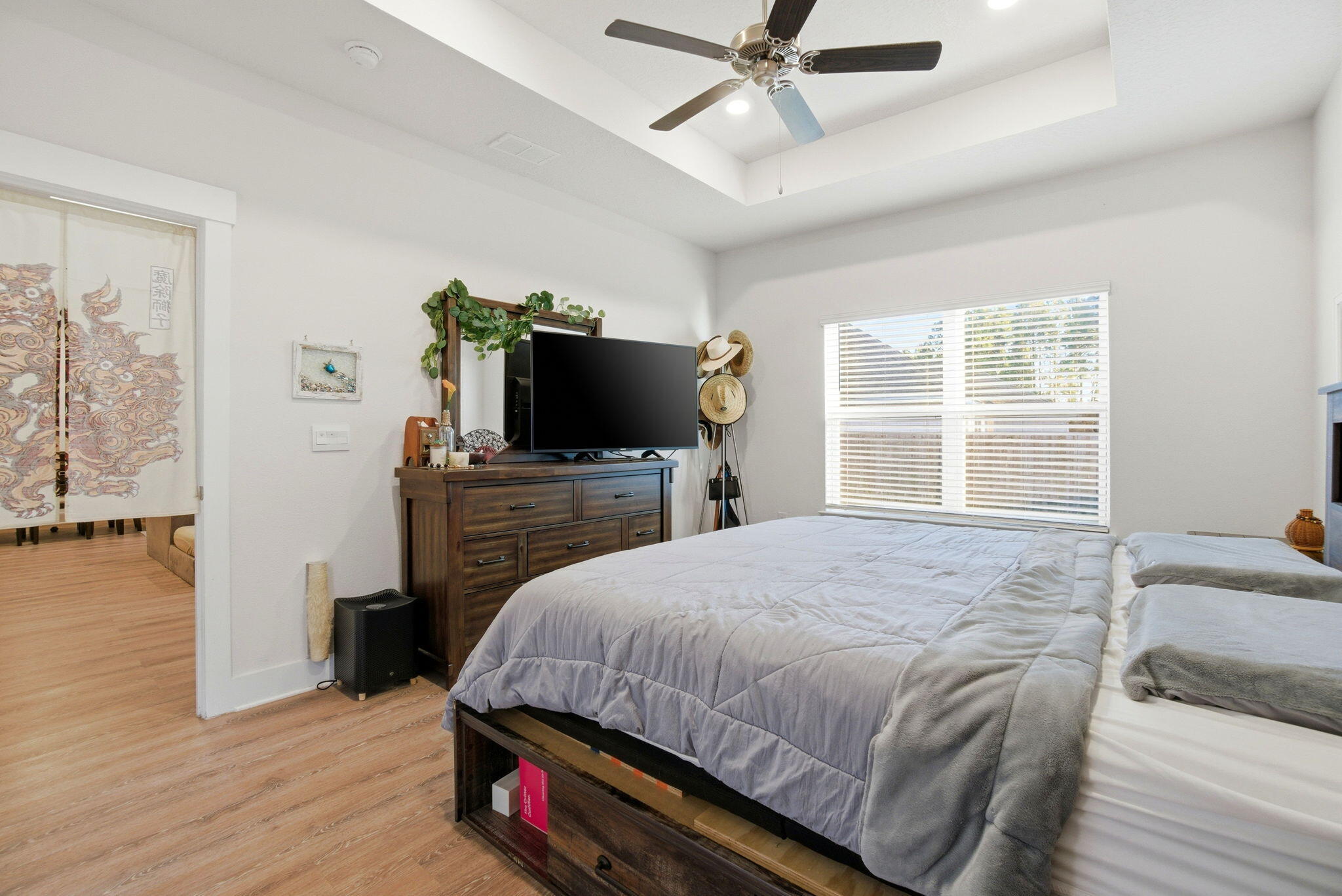 4067 Blaney Lane Pace, FL 32571 - Photo 18 of 40 a bedroom with a bed and a flat screen tv