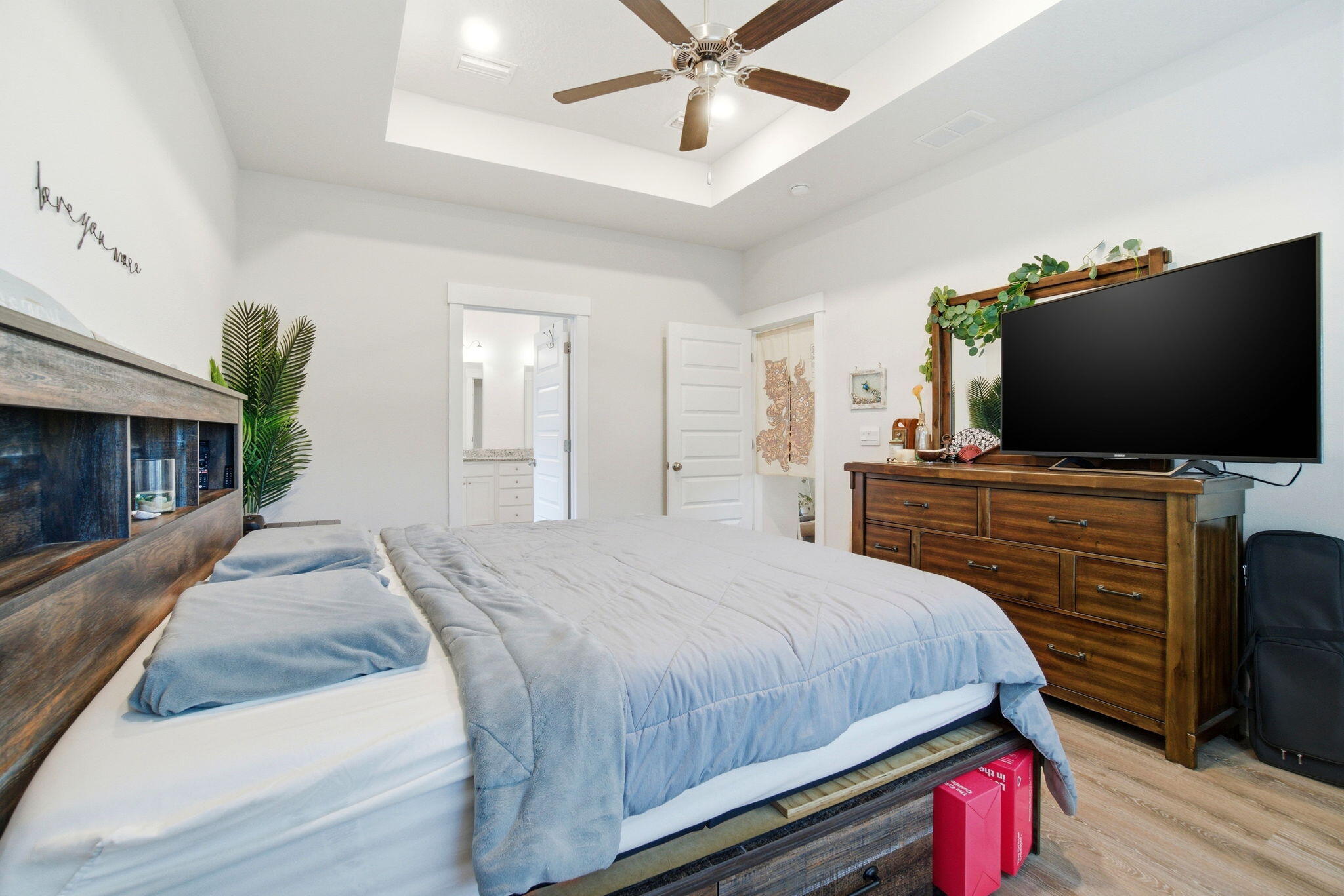 4067 Blaney Lane Pace, FL 32571 - Photo 20 of 40 a bedroom with a bed and a flat screen tv