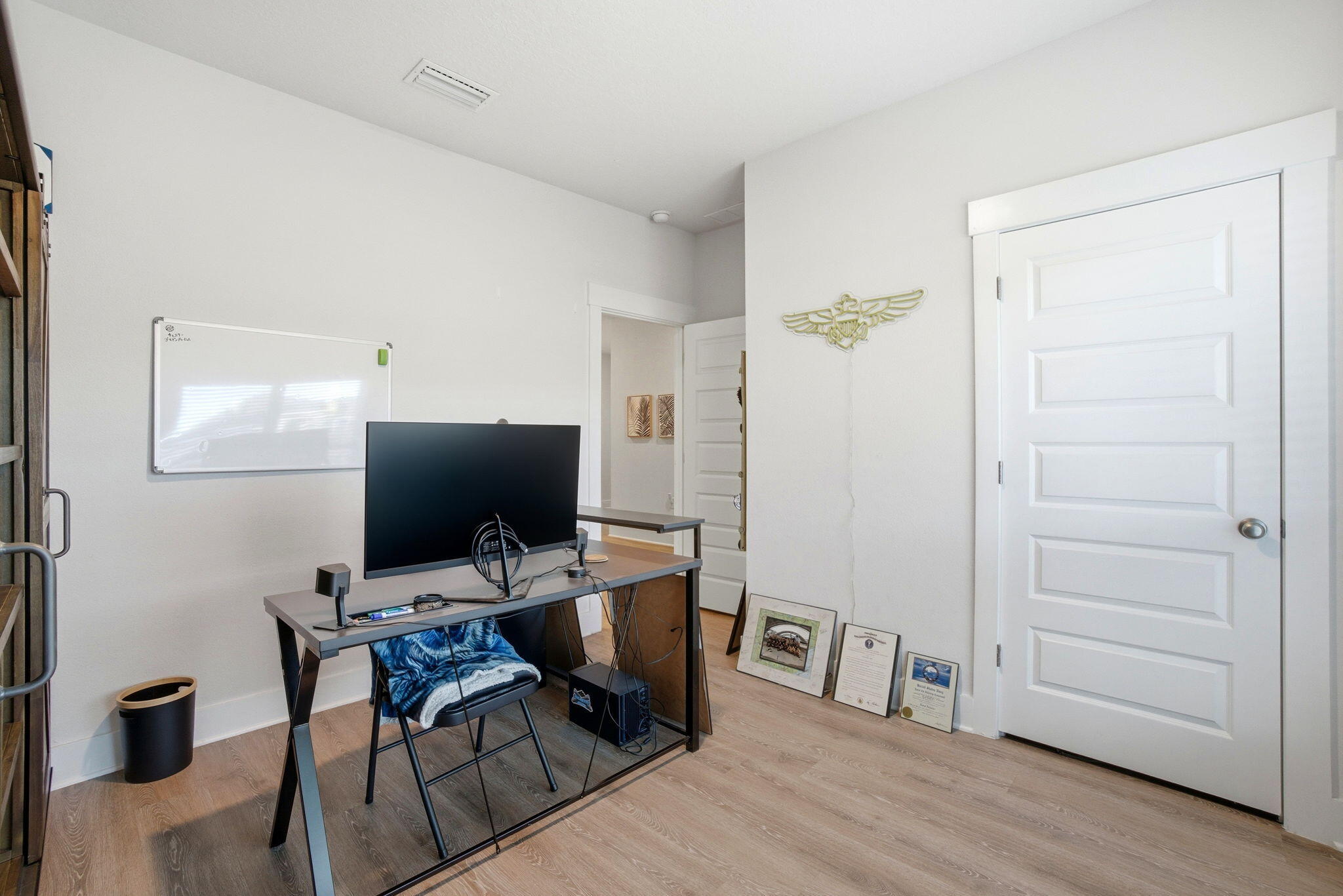 4067 Blaney Lane Pace, FL 32571 - Photo 25 of 40 a view of a workspace with furniture and wooden floor