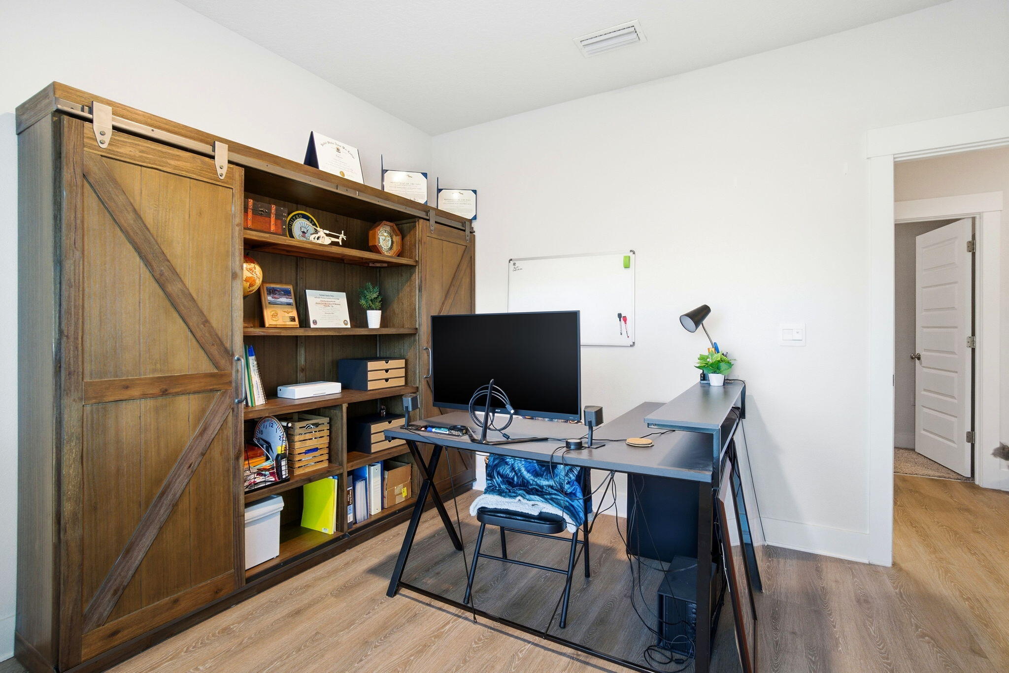 4067 Blaney Lane Pace, FL 32571 - Photo 26 of 40 a workspace with furniture and wooden floor