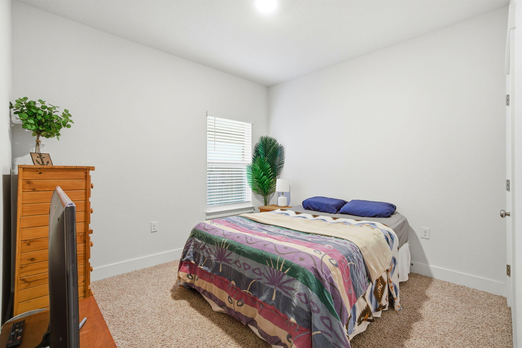 4067 Blaney Lane Pace, FL 32571 - Photo 27 of 40 a bedroom with a bed and wooden floor