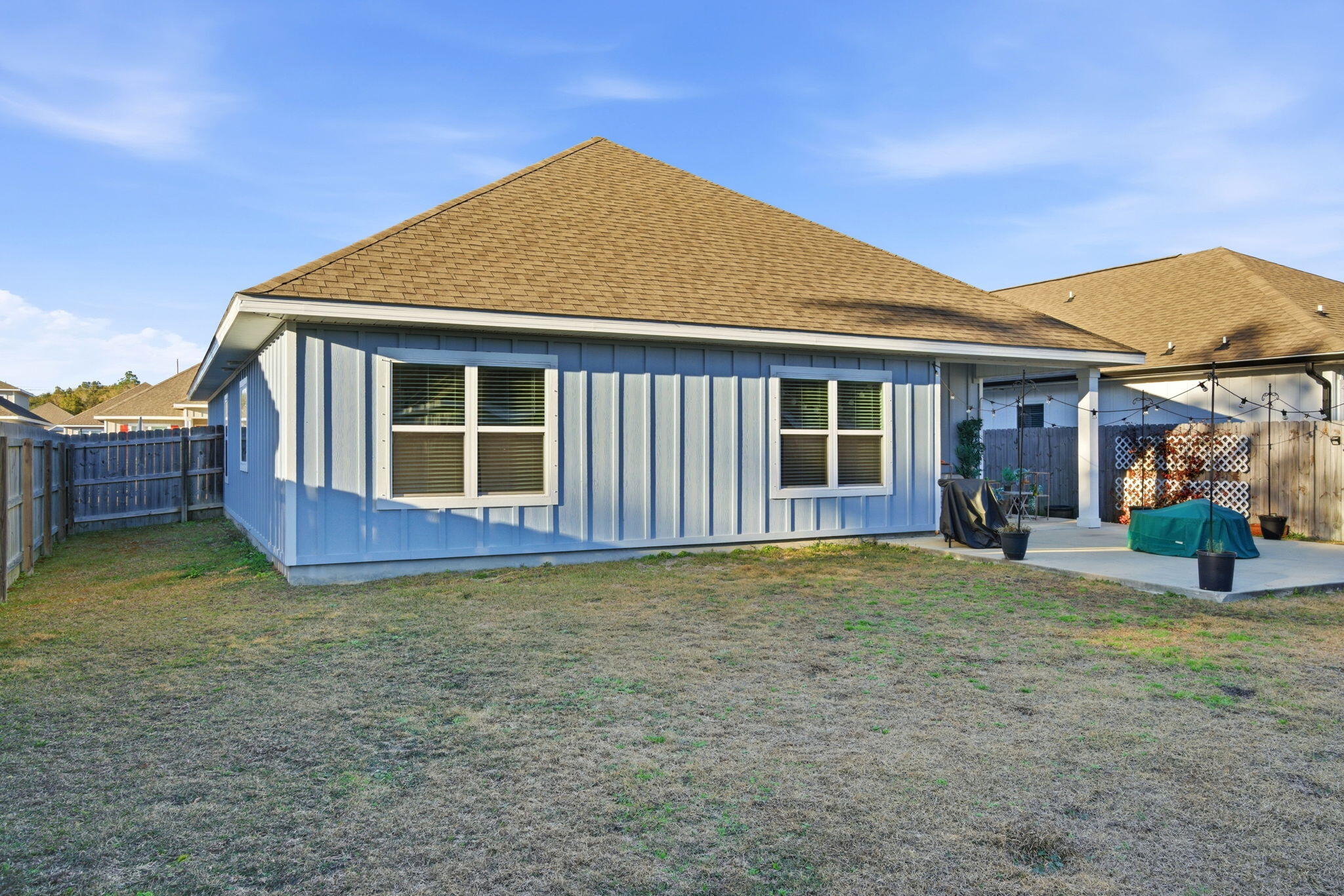 4067 Blaney Lane Pace, FL 32571 - Photo 38 of 40 a view of a house with backyard and porch