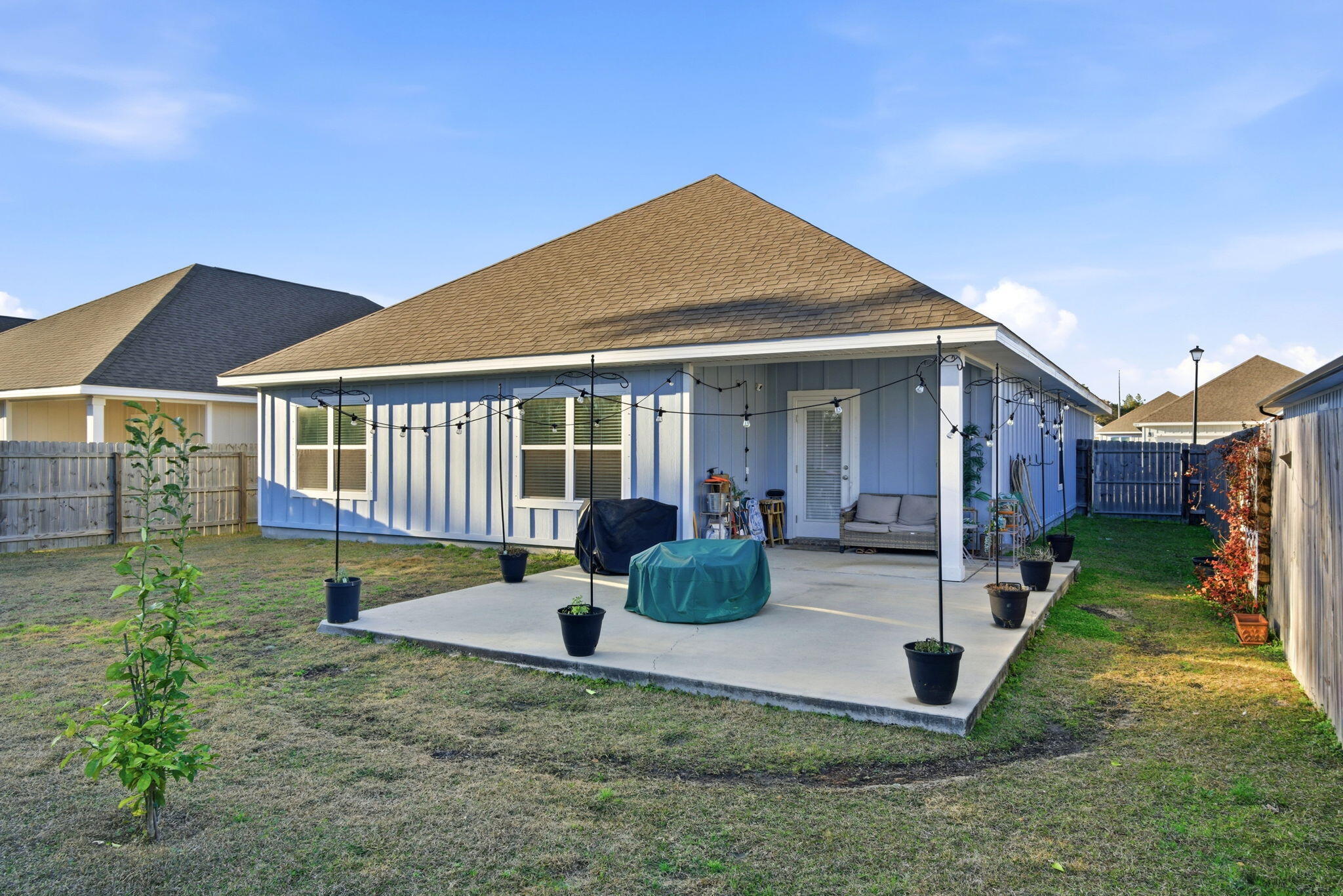 4067 Blaney Lane Pace, FL 32571 - Photo 39 of 40 a front view of house with yard slide and table
