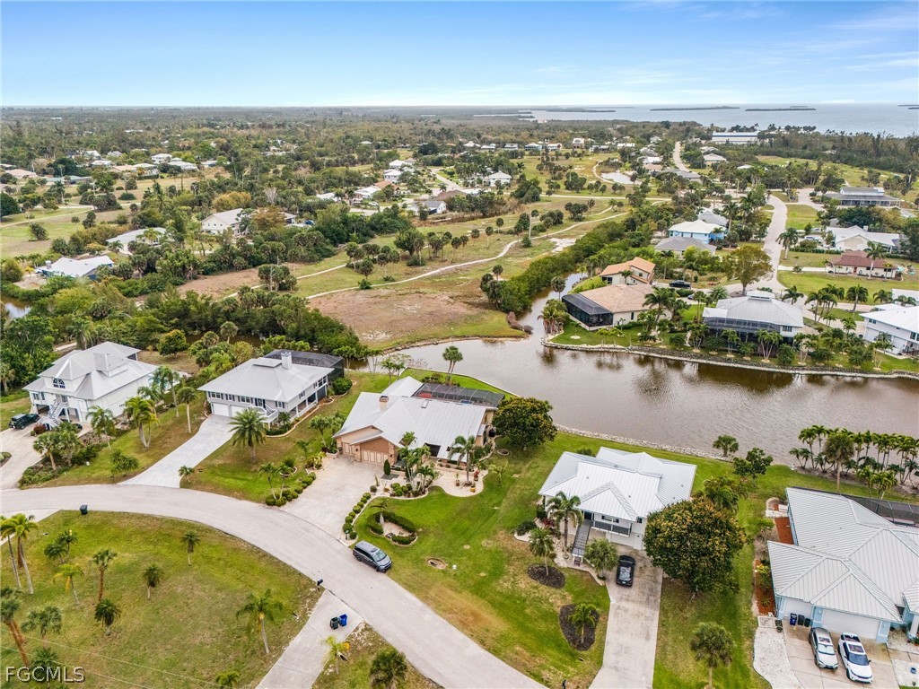 7747 Grande Pine Road Bokeelia, FL 33922 - Photo 42 of 45 an aerial view of residential houses with outdoor space