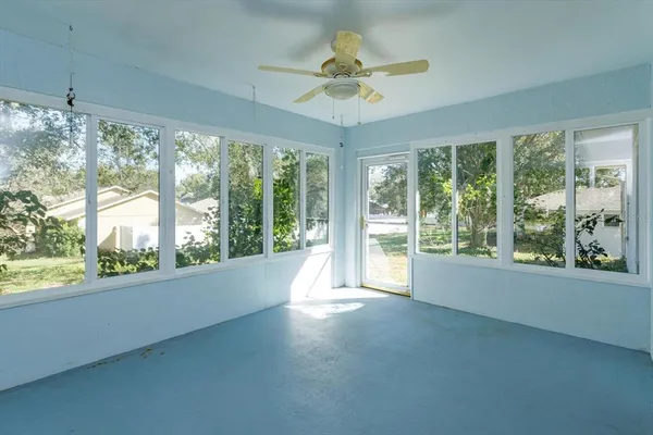 a view of an empty room with a window
