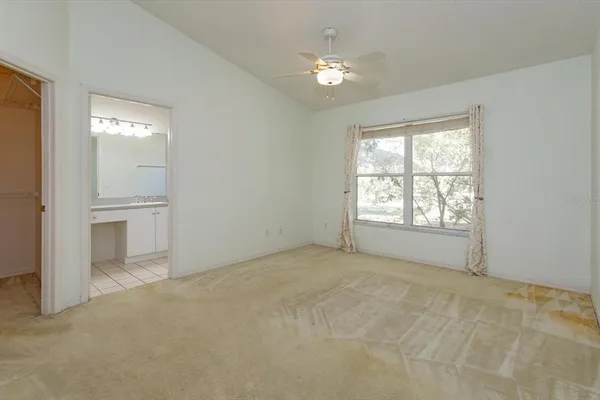 a view of an empty room with a window