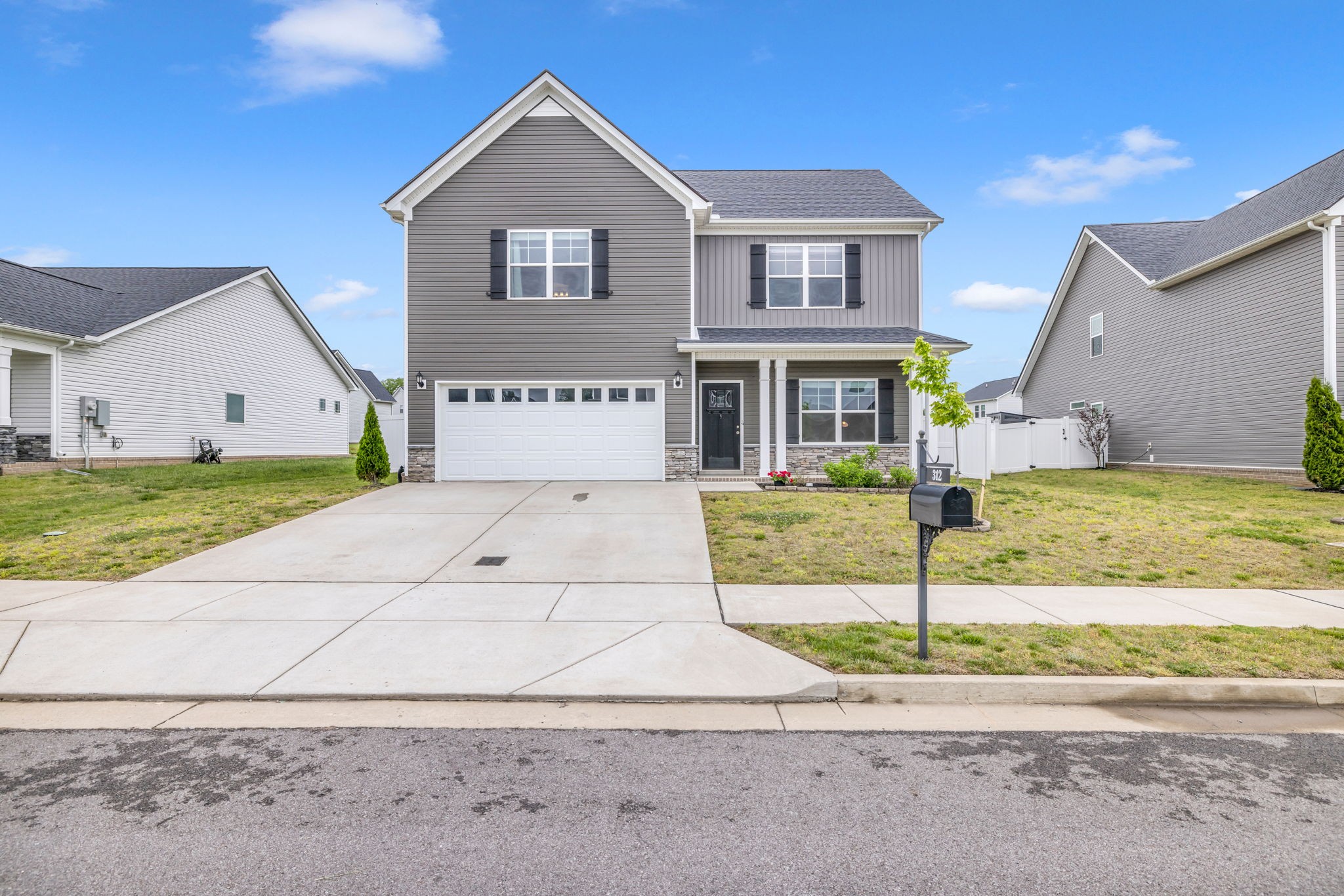 312 Turney Lane Spring Hill, TN 37174 - Photo 2 of 52 a front view of a house with a yard