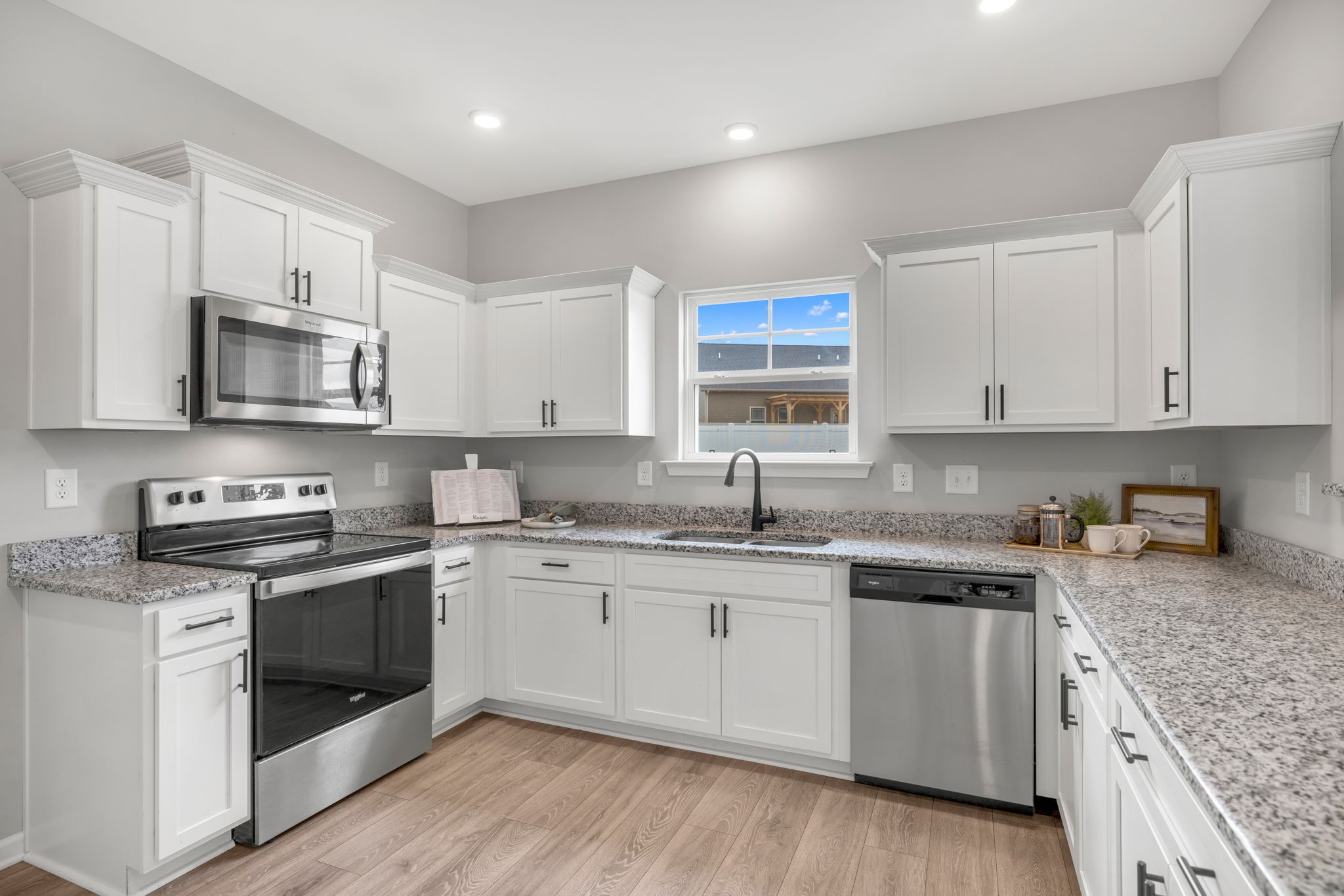 312 Turney Lane Spring Hill, TN 37174 - Photo 23 of 52 a kitchen with stainless steel appliances granite countertop a sink and stove top oven