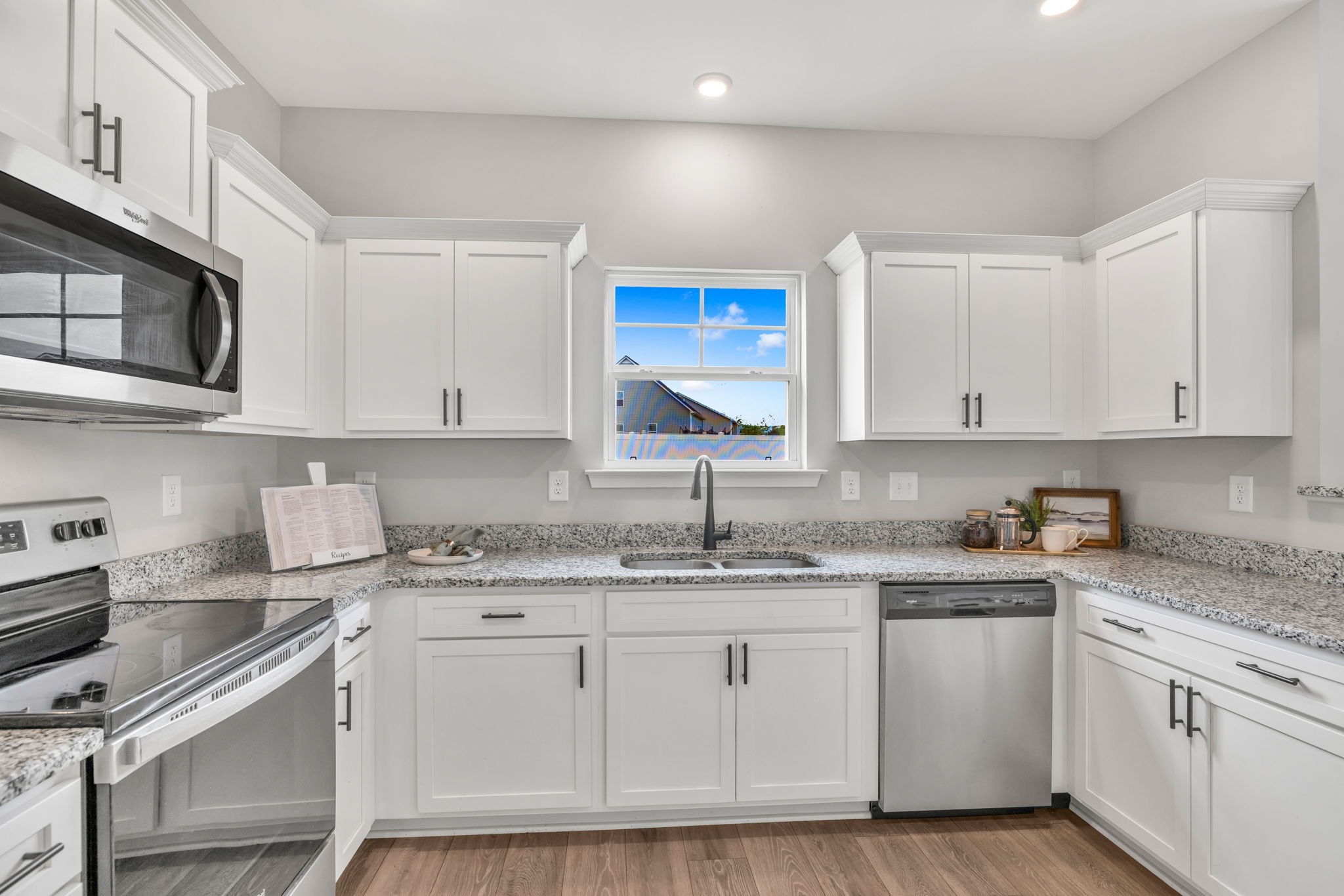 312 Turney Lane Spring Hill, TN 37174 - Photo 24 of 52 a kitchen with granite countertop white cabinets white stainless steel appliances and sink