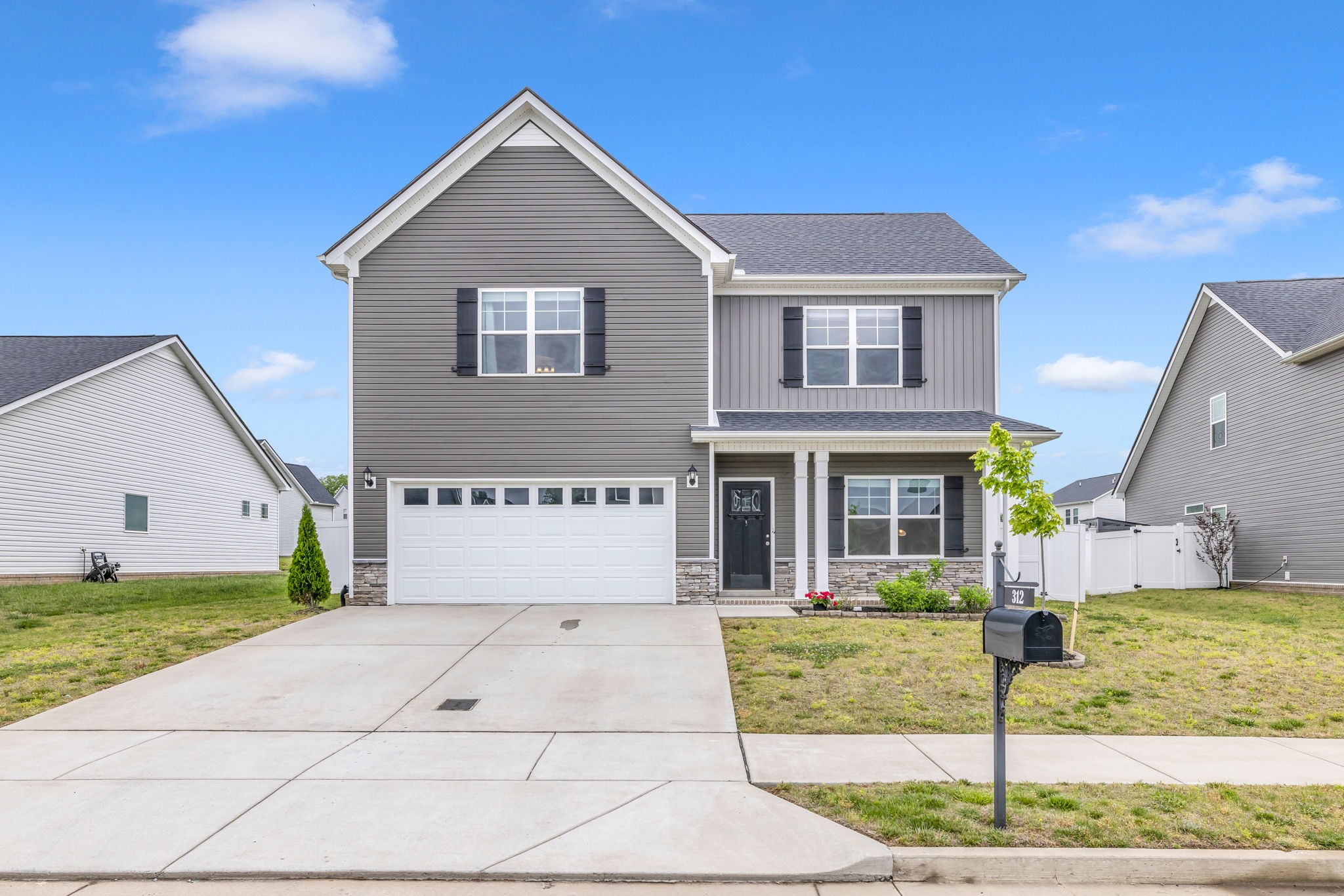 312 Turney Lane Spring Hill, TN 37174 - Photo 3 of 52 a front view of a house with a yard