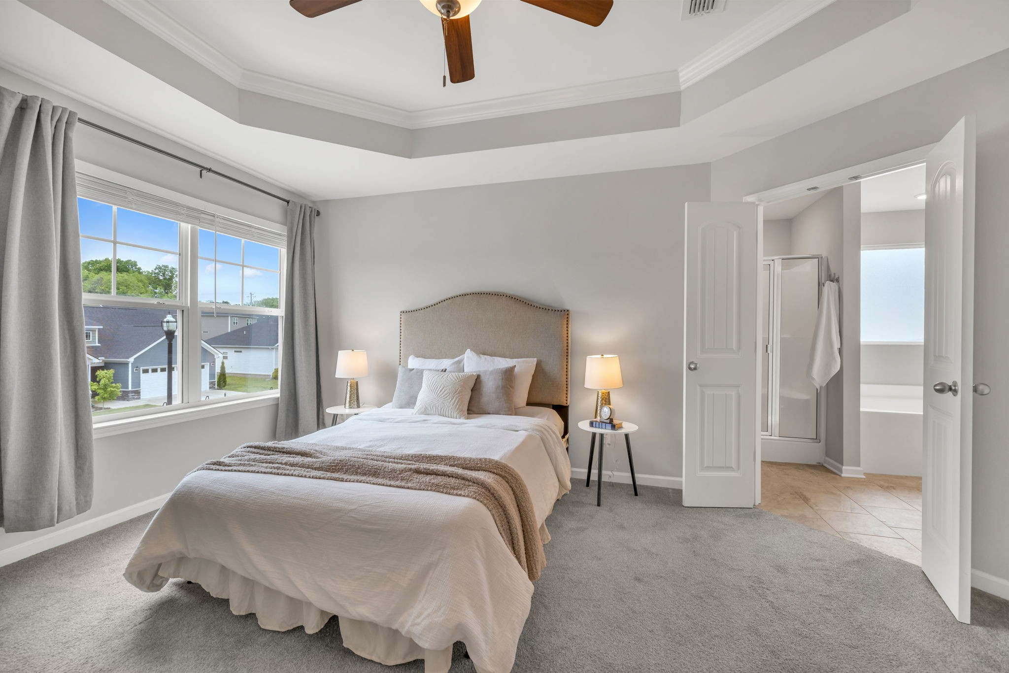 312 Turney Lane Spring Hill, TN 37174 - Photo 33 of 52 a bedroom with a bed and a chandelier