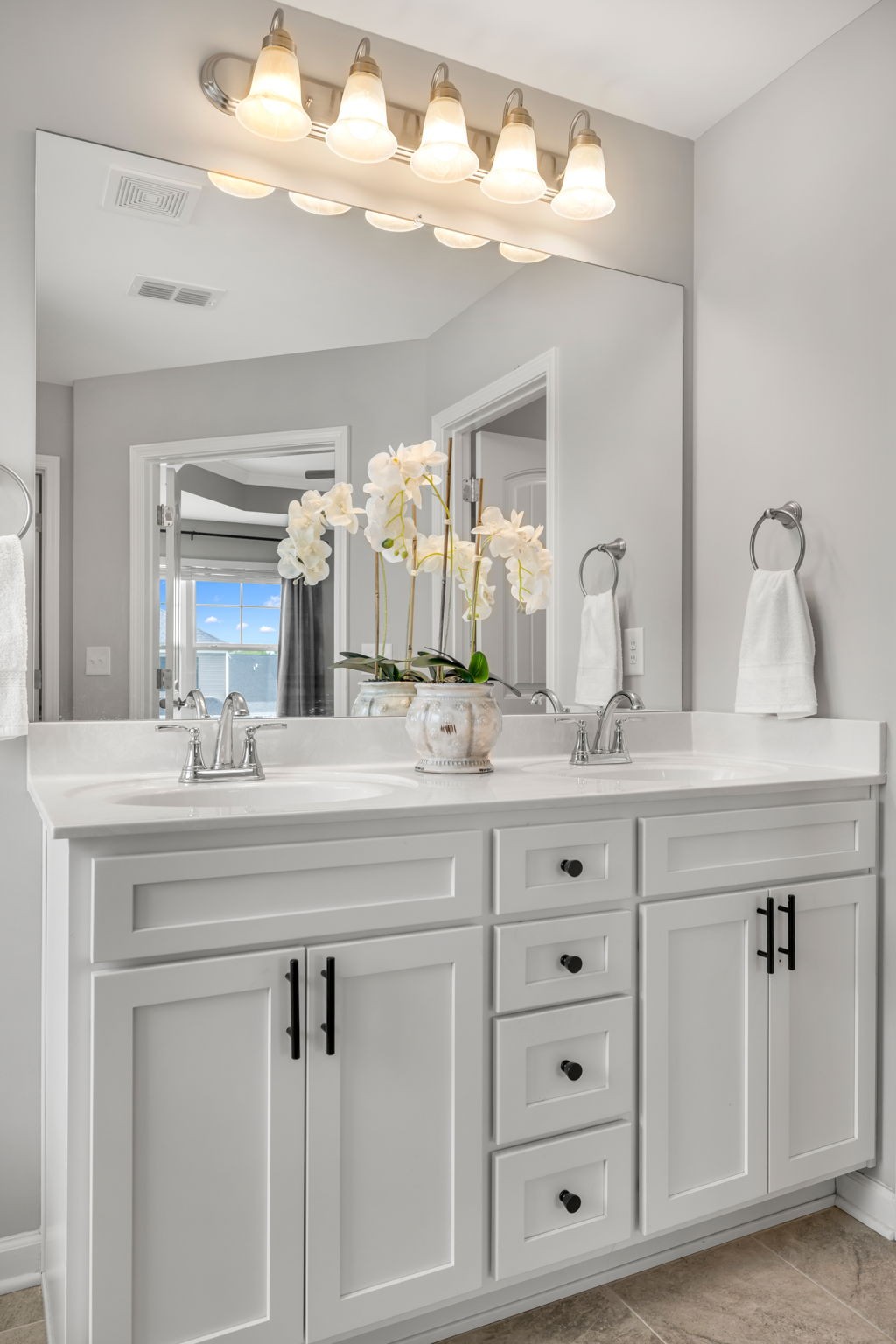 312 Turney Lane Spring Hill, TN 37174 - Photo 36 of 52 a bathroom with cabinets stainless steel appliances a sink and a mirror