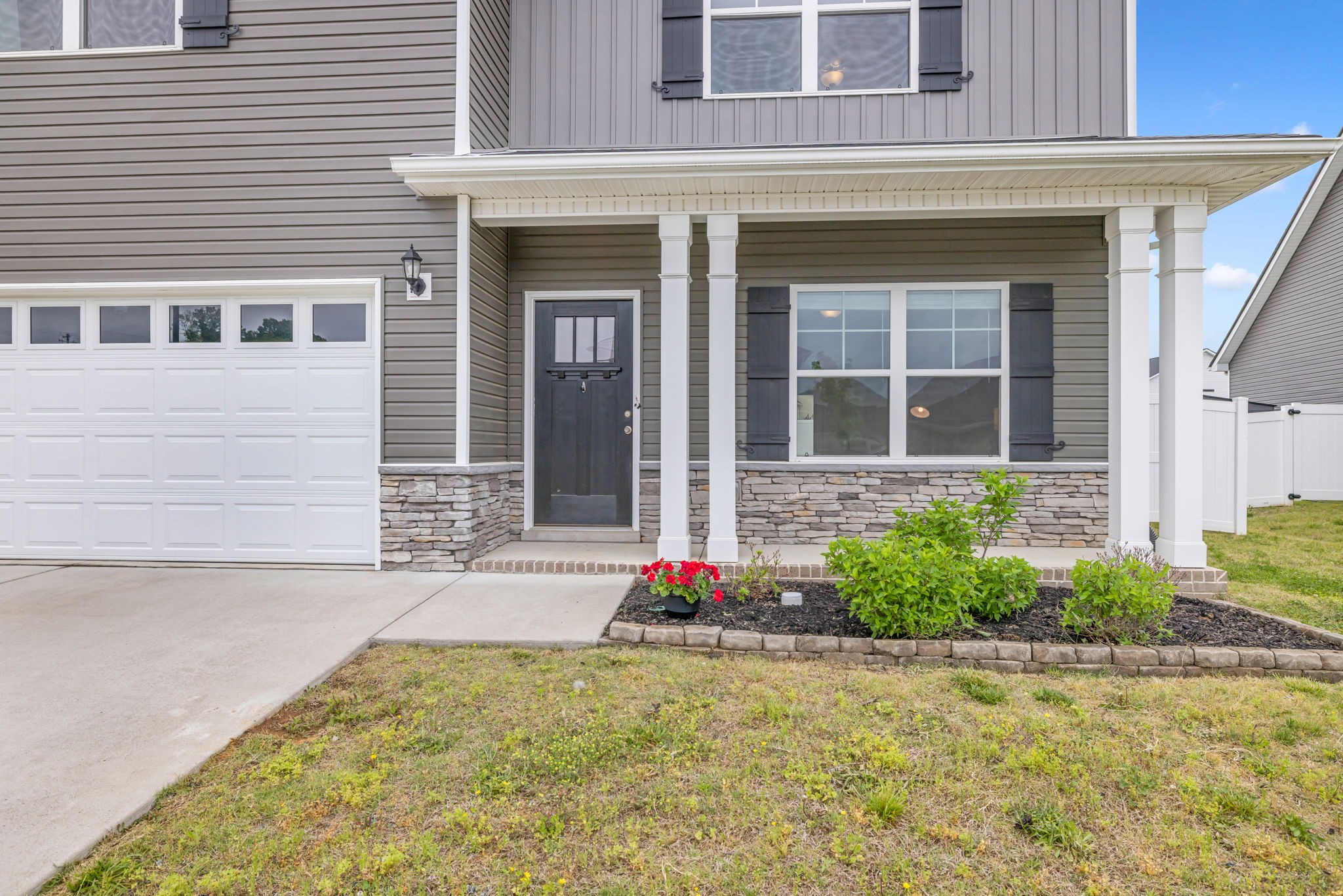 312 Turney Lane Spring Hill, TN 37174 - Photo 6 of 52 front view of a brick house with a yard