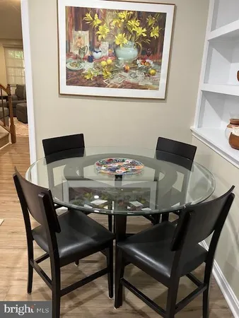 a kitchen with stainless steel appliances granite countertop a sink and a microwave