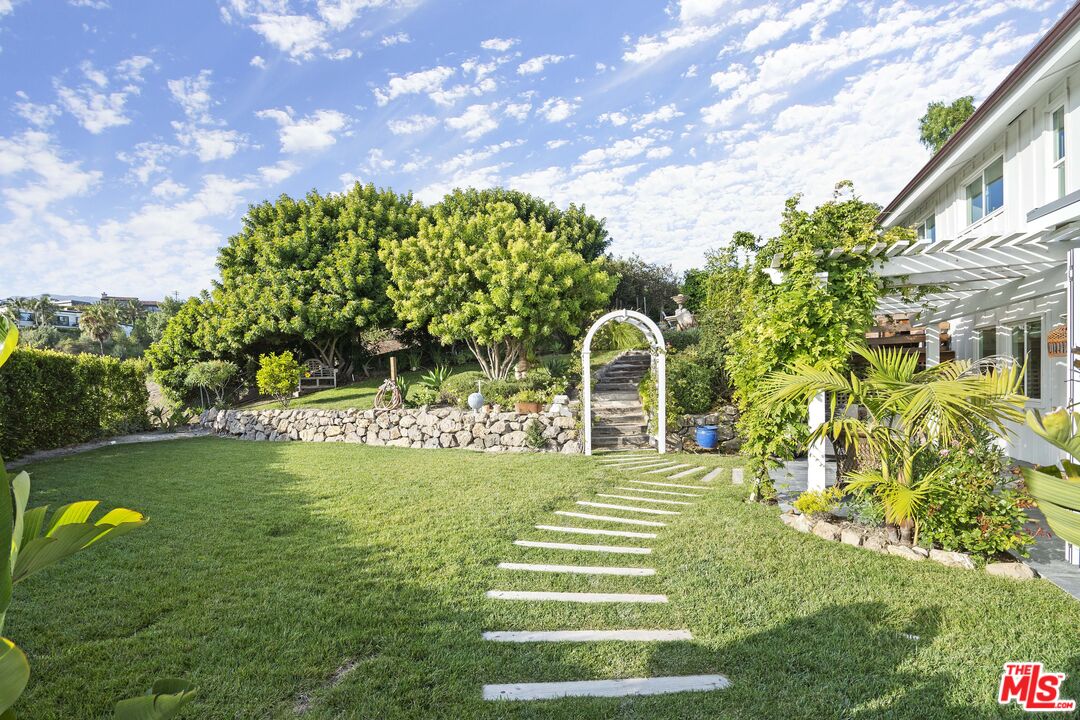 6363 Zumirez Drive Malibu, CA 90265 - Photo 27 of 34 a view of swimming pool from a garden