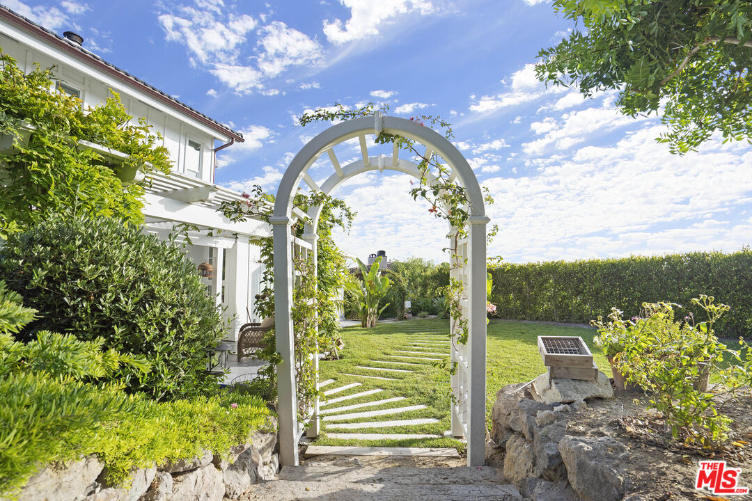 6363 Zumirez Drive Malibu, CA 90265 - Photo 28 of 34 a view of a city from a balcony