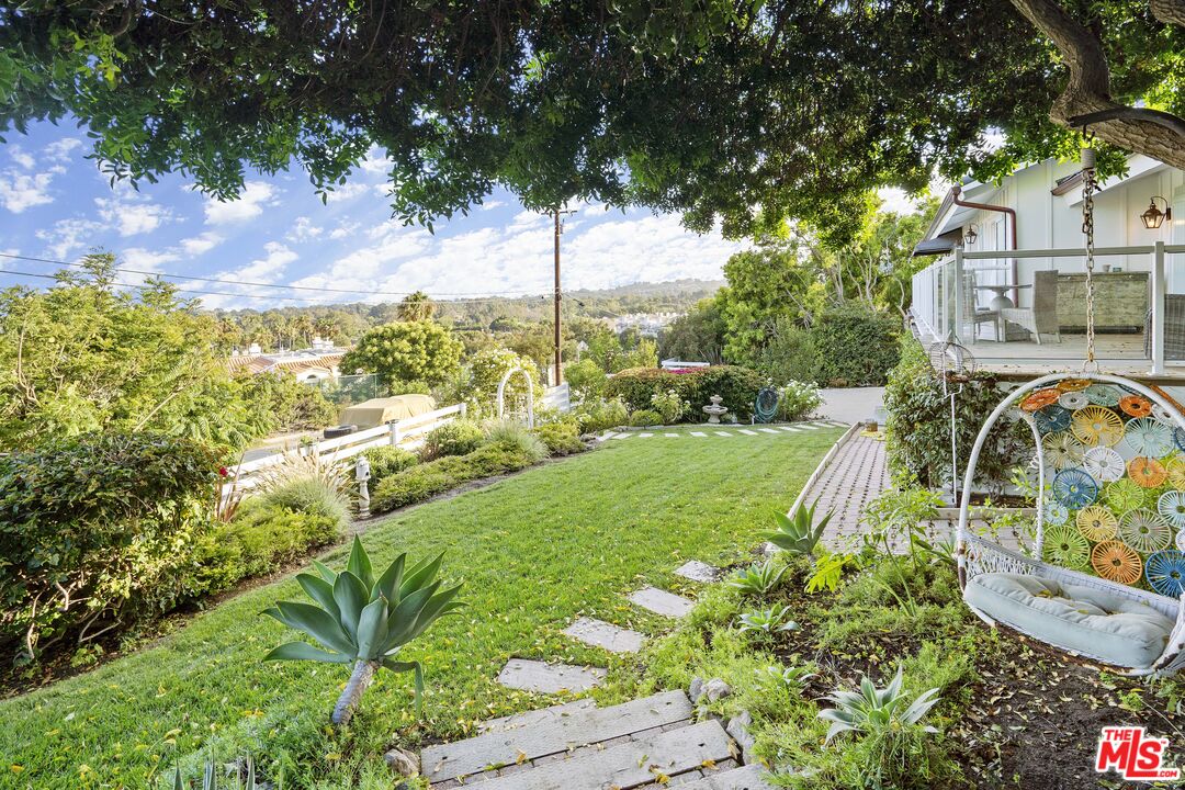 6363 Zumirez Drive Malibu, CA 90265 - Photo 31 of 34 a view of a garden with a fountain