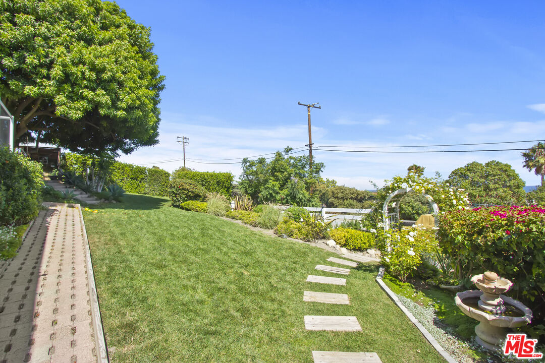6363 Zumirez Drive Malibu, CA 90265 - Photo 32 of 34 a view of a garden with sitting area