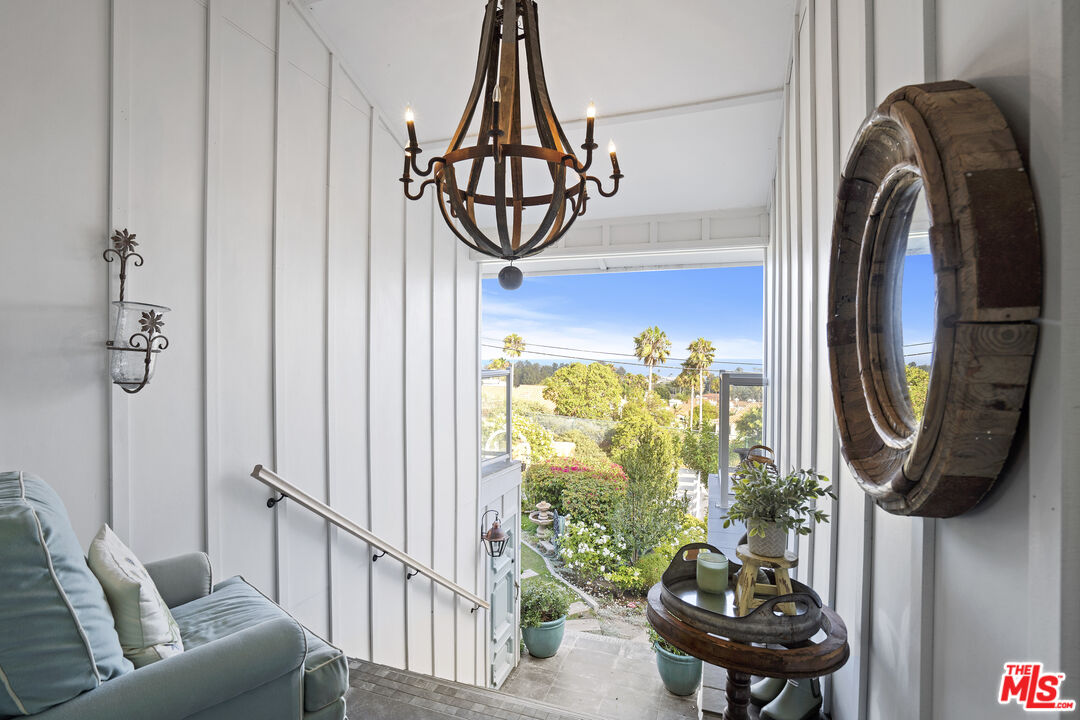 6363 Zumirez Drive Malibu, CA 90265 - Photo 5 of 34 a living room with furniture and a window
