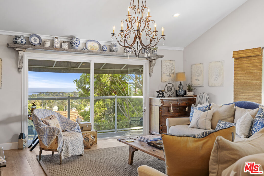 6363 Zumirez Drive Malibu, CA 90265 - Photo 7 of 34 a living room with furniture and a fireplace