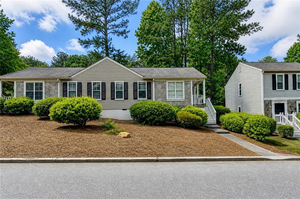 3400 Spring Harbor Drive Doraville, GA 30340 - Photo 1 of 33 a front view of a house with a garden