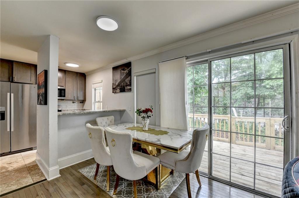 3400 Spring Harbor Drive Doraville, GA 30340 - Photo 12 of 33 a view of a dining room with furniture window and wooden floor