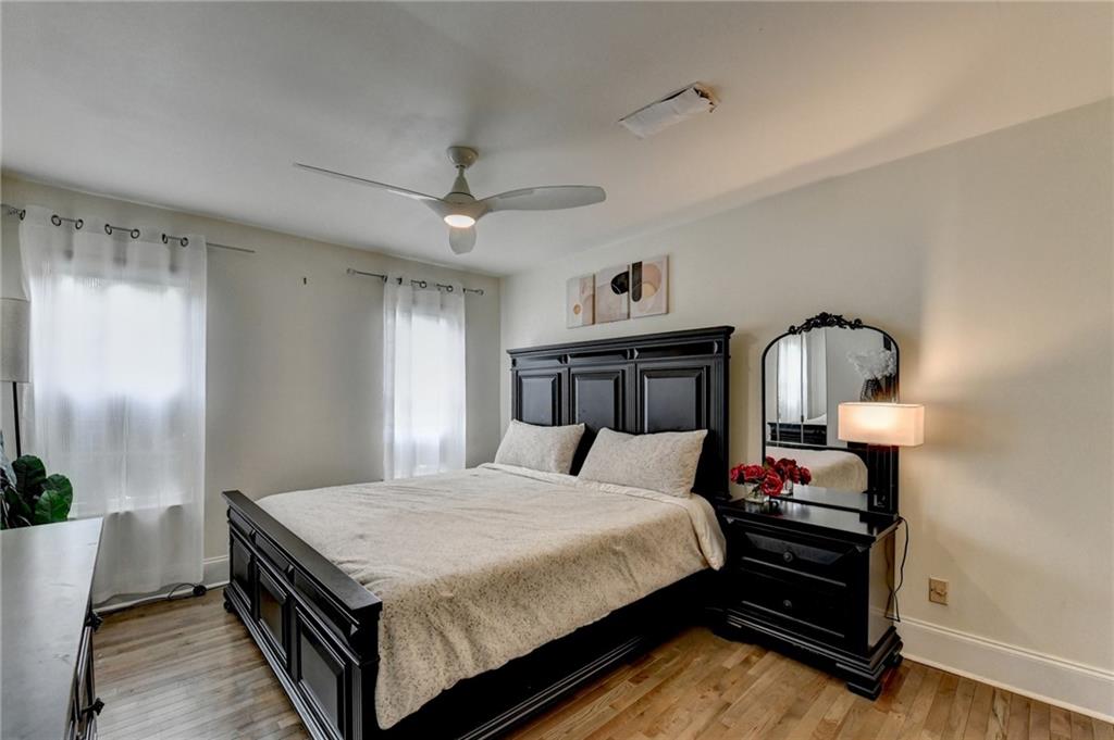 3400 Spring Harbor Drive Doraville, GA 30340 - Photo 21 of 33 a bedroom with a bed and a chandelier