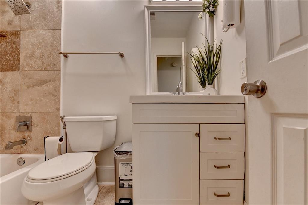 3400 Spring Harbor Drive Doraville, GA 30340 - Photo 27 of 33 a bathroom with a toilet a sink and tub