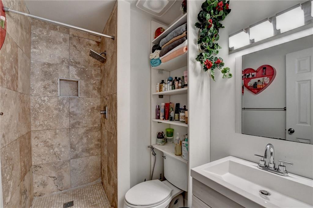 3400 Spring Harbor Drive Doraville, GA 30340 - Photo 28 of 33 a bathroom with a sink mirror and toilet