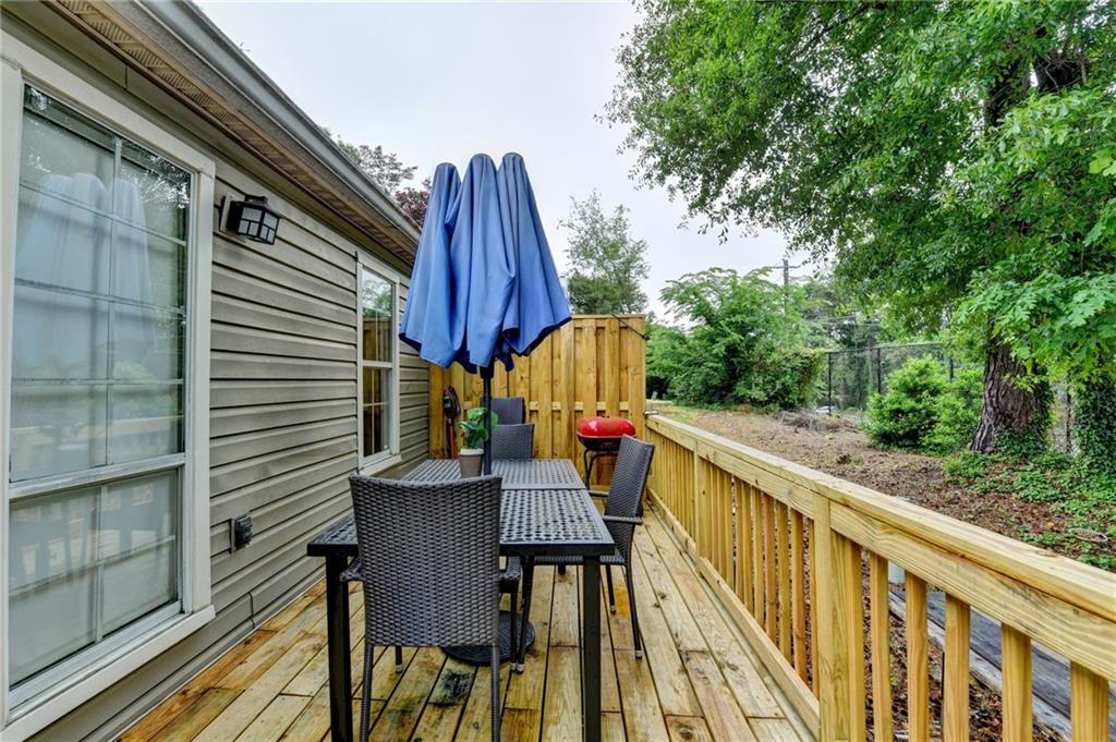 3400 Spring Harbor Drive Doraville, GA 30340 - Photo 31 of 33 a view of deck with furniture and trees