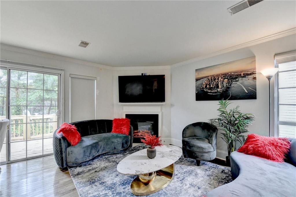 3400 Spring Harbor Drive Doraville, GA 30340 - Photo 5 of 33 a living room with furniture fireplace and flat screen tv