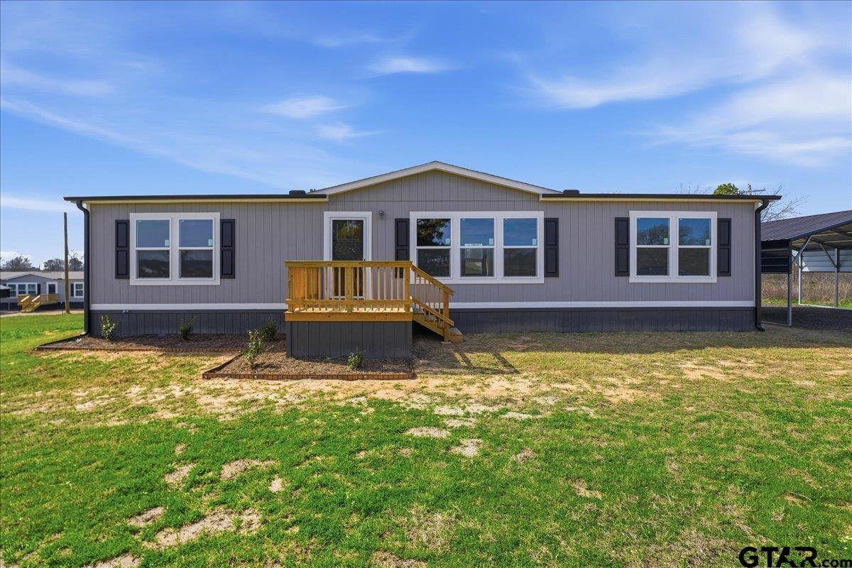 8886 Bayberry Road Gilmer, TX 75645 - Photo 1 of 24 a front view of a house with a yard