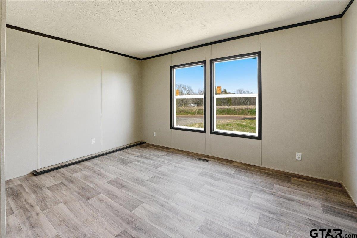 8886 Bayberry Road Gilmer, TX 75645 - Photo 15 of 24 a view of an empty room with a window