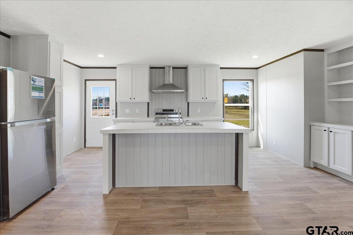 8886 Bayberry Road Gilmer, TX 75645 - Photo 23 of 24 a bathroom with a sink a mirror and a shower