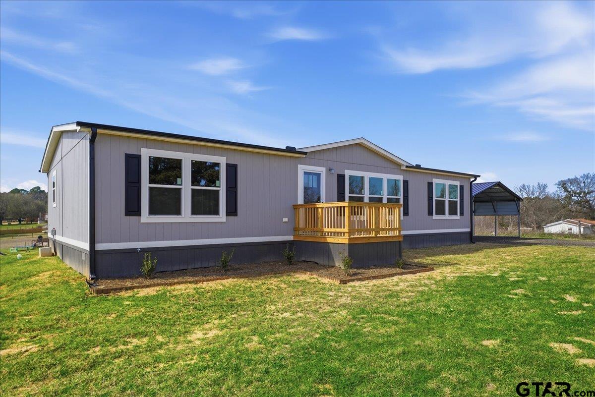 8886 Bayberry Road Gilmer, TX 75645 - Photo 3 of 24 a house view with a garden space