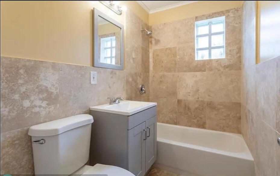 808 West 4th Street Riviera Beach, FL 33404 - Photo 6 of 10 a bathroom with a sink toilet and shower