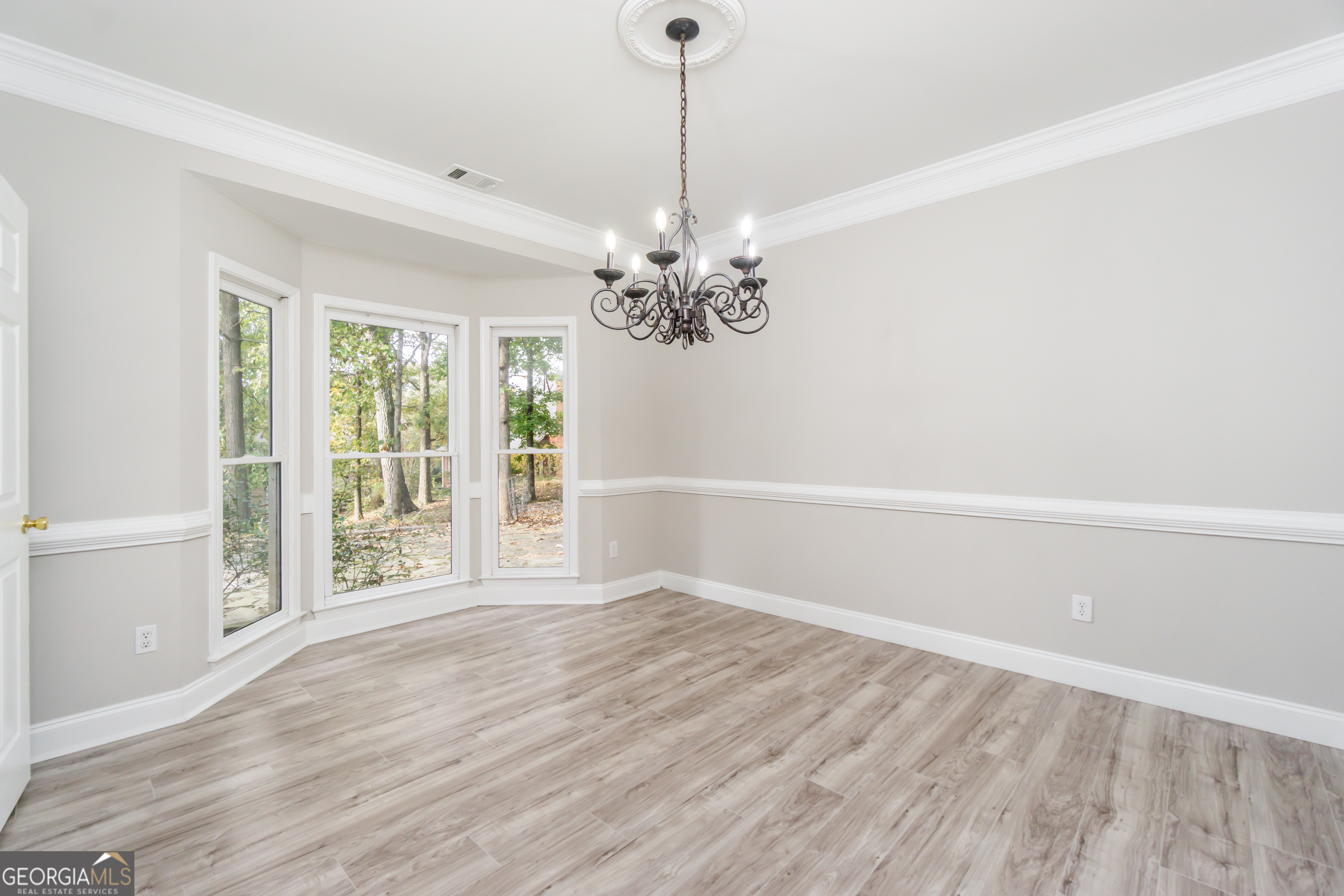 6710 Timber Cove Pointe Cumming, GA 30041 - Photo 11 of 51 wooden floor in an empty room with a window