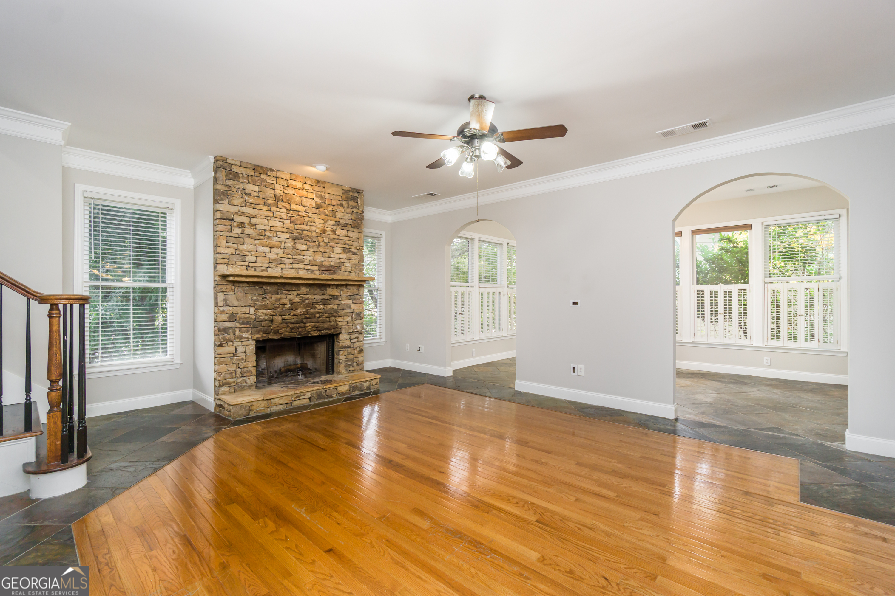 6710 Timber Cove Pointe Cumming, GA 30041 - Photo 19 of 51 a view of an empty room with a fireplace and a window