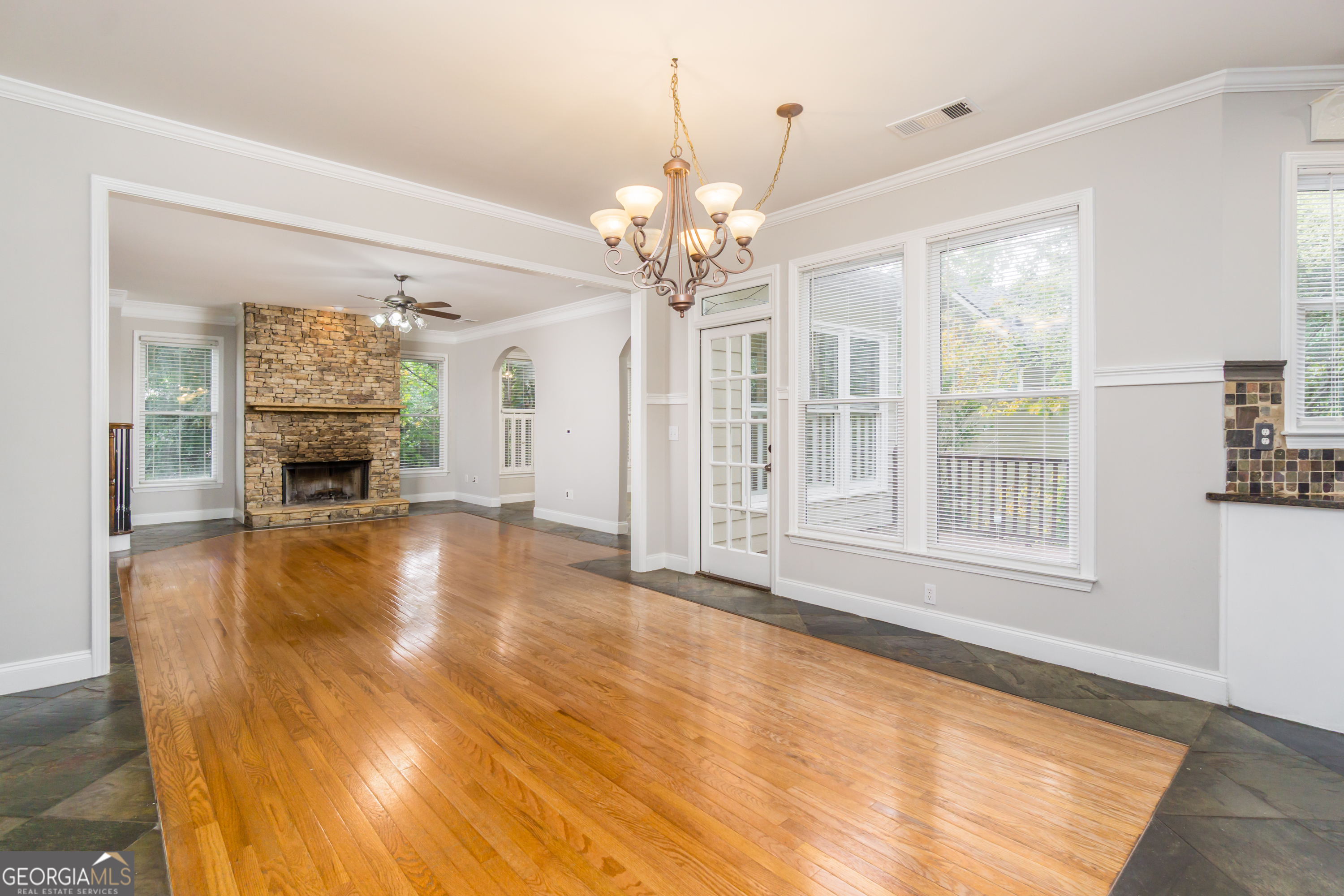 6710 Timber Cove Pointe Cumming, GA 30041 - Photo 5 of 51 a view of an empty room with a fireplace and a window