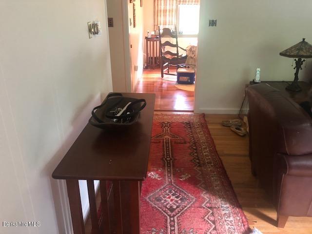 71 South Sandisfield Road Sandisfield, MA 01255 - Photo 8 of 22 a room with furniture and a gate