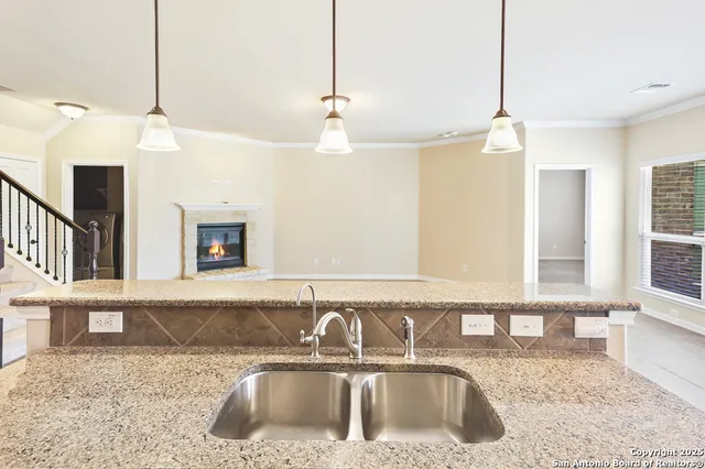 a kitchen with a sink and a window