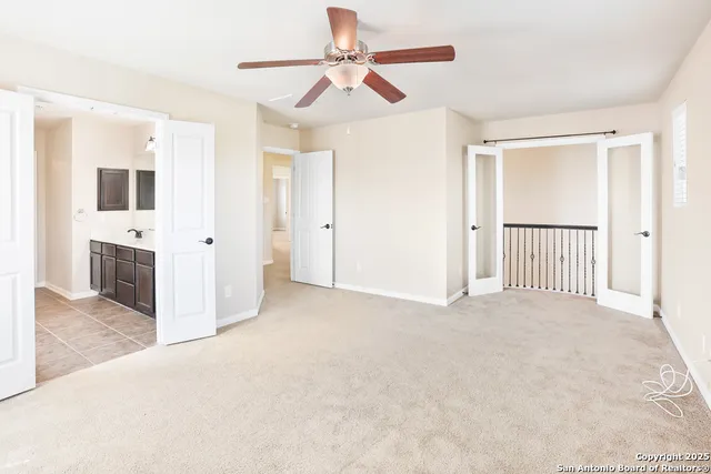 a bathroom with a sink vanity tub and shower