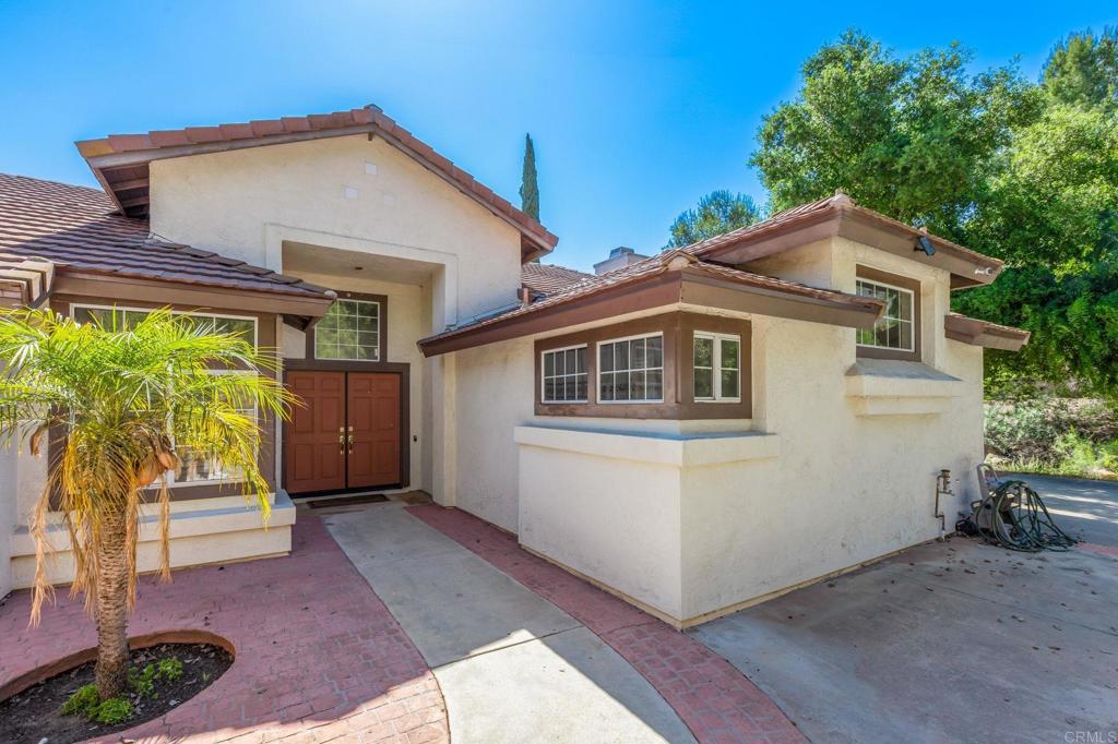 3602 Hidden Ridge Road Jamul, CA 91935 - Photo 1 of 1 a front view of a house with a yard
