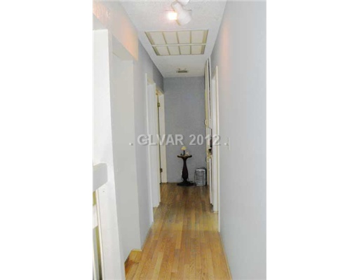 4797 Monaco Road Las Vegas, NV 89121 - Photo 10 of 20 Interior Space/Layout. Upstairs Hallway. Wood Floors